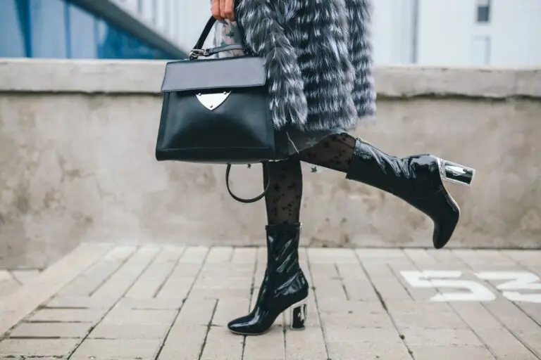 Buy Less Choose Well Close Up Accessories Details Stylish Woman Walking City Warm Fur Coat Winter Season Cold Weather Holding Leather Handbag Legs Boots Footwear Street Fashion Trend 1 768x512