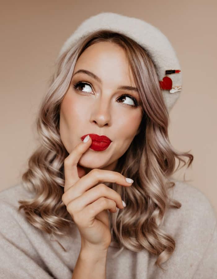 Curious Well Dressed Woman Thinking About Something With Smile 1