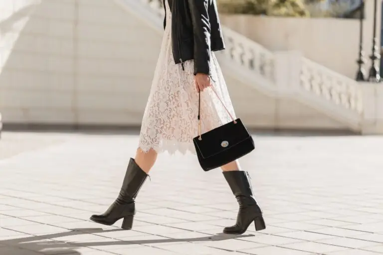 Buy Less Choose Well Young Pretty Woman Walking Street Fashionable Outfit Holding Purse Wearing Black Leather Jacket White Lace Dress Spring Autumn Style Warm Sunny Weather Romantic Look 1 768x512